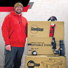 Woodworker standing next to SawStop compact table saw and portable stand boxes with woodworking accessories on top