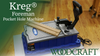 Kreg Foreman electric pocket hole machine with wood pieces set for drilling pocket holes on workshop floor
