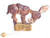 Hand-carved wooden donkey toy with movable legs and a pull string on a wooden base