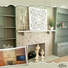 Fireplace with whitewashed brick surround and painted built-in wooden shelves before and after update