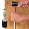 Hand holding WoodRiver chisel mallet striking chisel with wooden handle on workbench