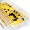Yellow precision tapering jig clamped to table saw with wooden boards positioned for angled cuts.